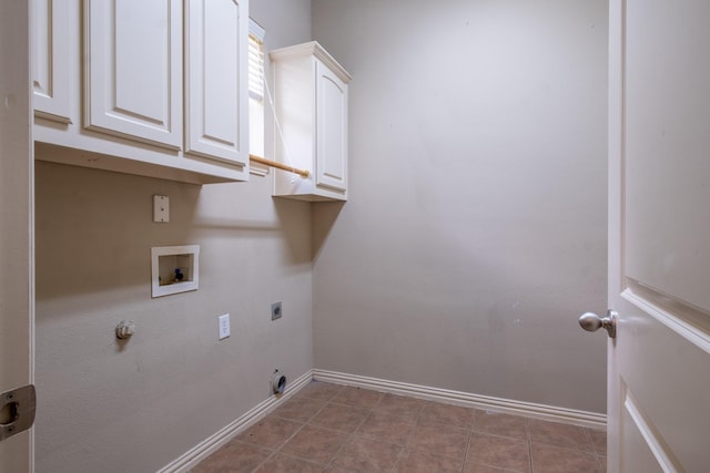 laundry room with electric dryer hookup, cabinets, gas dryer hookup, washer hookup, and light tile patterned floors