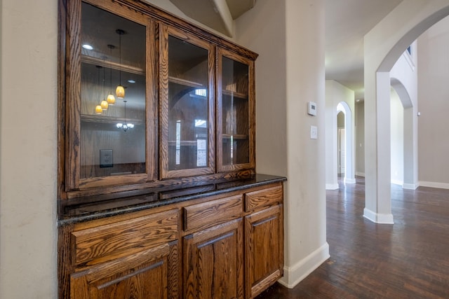 bar featuring dark hardwood / wood-style floors