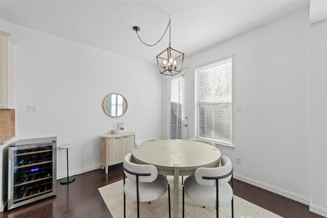 dining room featuring wine cooler, dark hardwood / wood-style floors, and an inviting chandelier