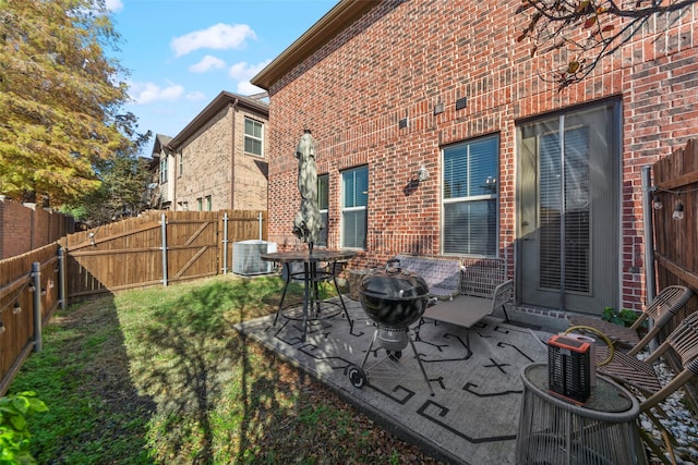 view of patio / terrace featuring an outdoor fire pit and central AC