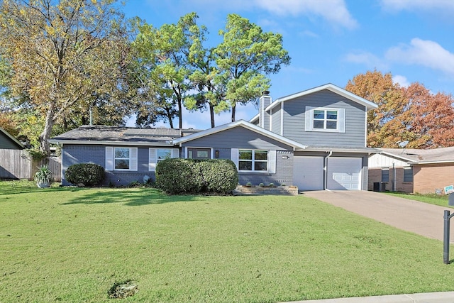 view of front of property featuring a garage, central air condition unit, and a front lawn