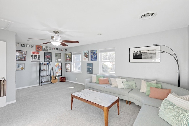 living room featuring light carpet and ceiling fan