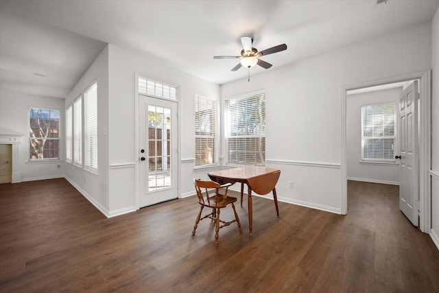 dining room with ceiling fan, dark hardwood / wood-style floors, and a healthy amount of sunlight