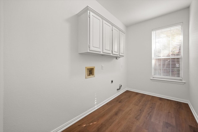 clothes washing area with dark hardwood / wood-style flooring, cabinets, hookup for a gas dryer, washer hookup, and electric dryer hookup