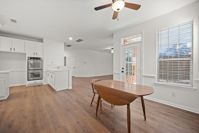 dining room with ceiling fan and light hardwood / wood-style floors