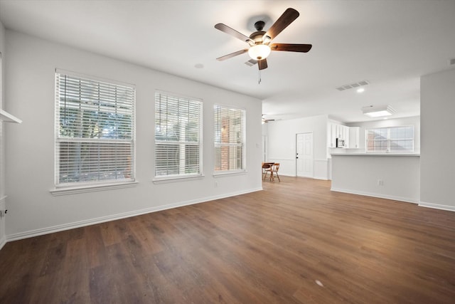 unfurnished living room featuring wood-type flooring and ceiling fan