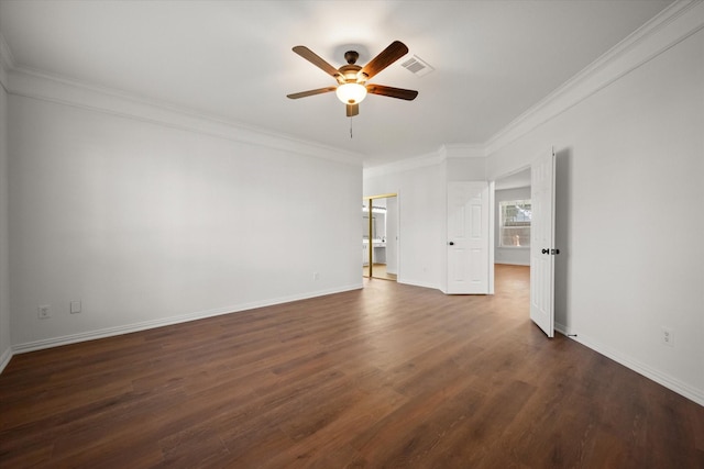 spare room with dark hardwood / wood-style flooring, crown molding, and ceiling fan