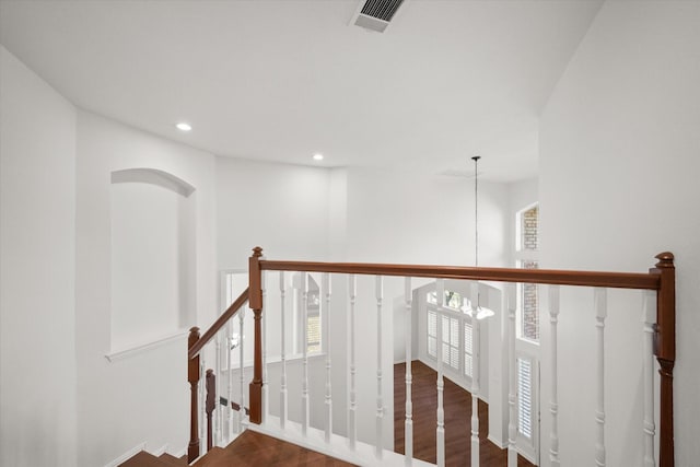 corridor with dark wood-type flooring