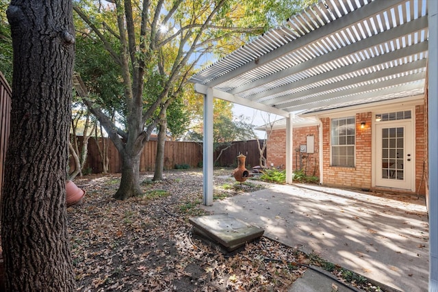 view of yard with a pergola and a patio area