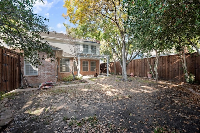 back of house featuring a pergola