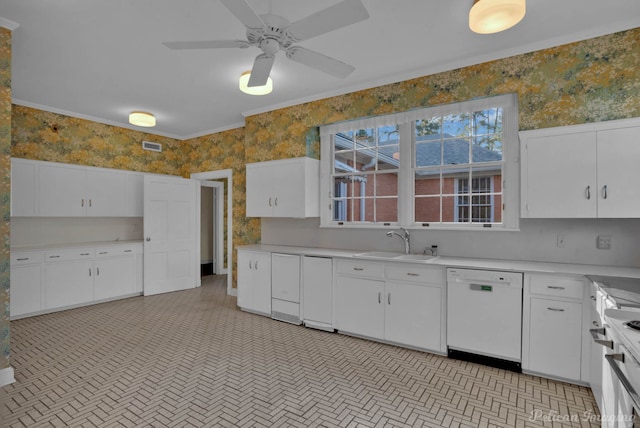 kitchen with white appliances, white cabinets, crown molding, sink, and ceiling fan