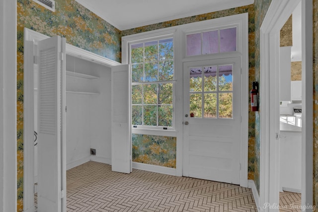 doorway to outside featuring a wealth of natural light