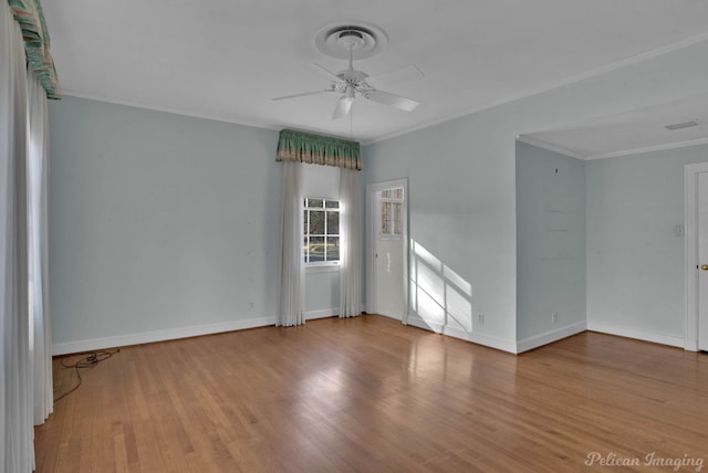 unfurnished room with crown molding, light hardwood / wood-style flooring, and ceiling fan