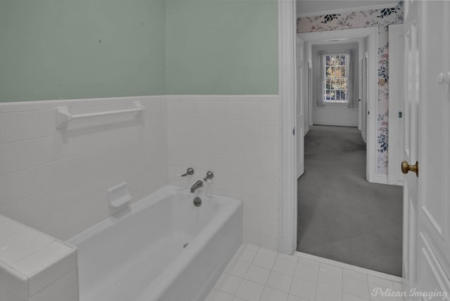 bathroom featuring a tub and tile patterned flooring