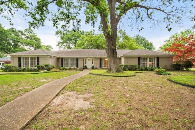 ranch-style house with a front lawn
