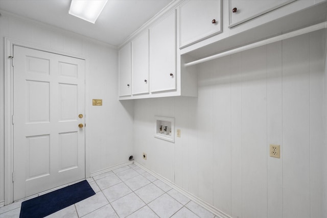 laundry room with crown molding, electric dryer hookup, cabinet space, light tile patterned floors, and washer hookup