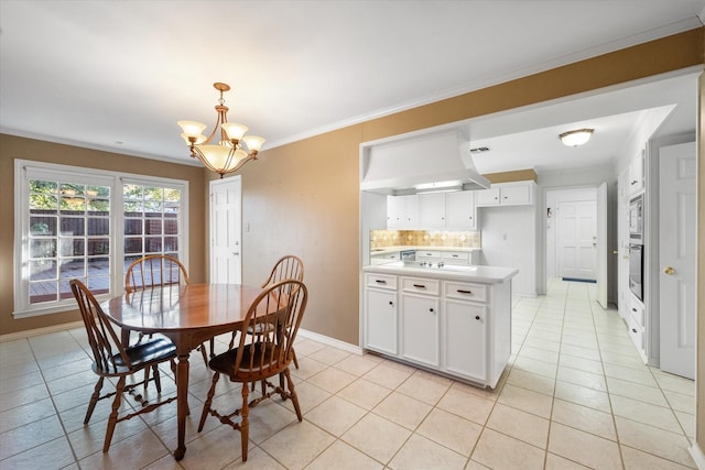 dining room featuring ornamental molding, a chandelier, and light tile patterned floors