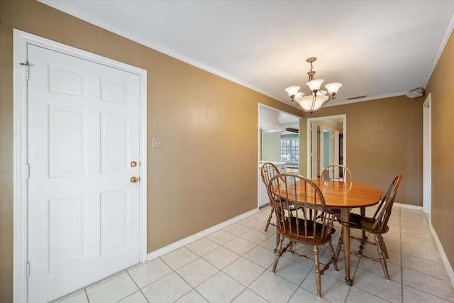 dining area with ornamental molding, light tile patterned flooring, and an inviting chandelier