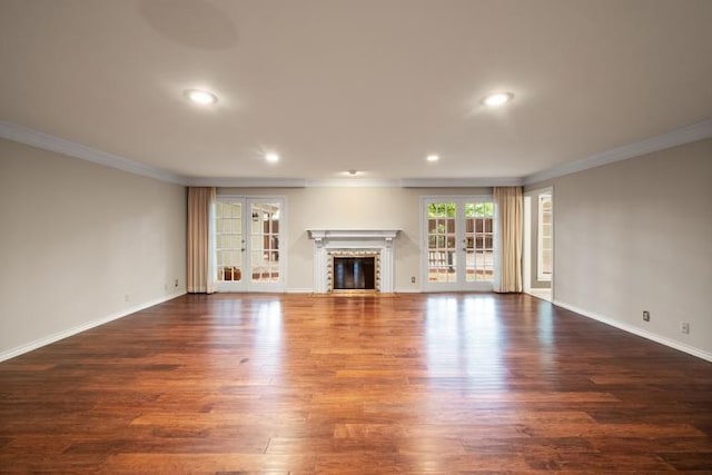 unfurnished living room with crown molding, recessed lighting, baseboards, and dark wood-type flooring