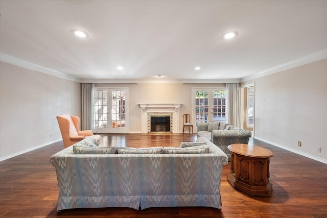 living room featuring ornamental molding, dark hardwood / wood-style flooring, and french doors