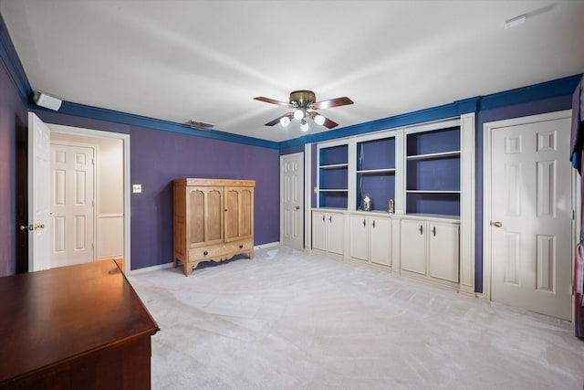 unfurnished bedroom with ceiling fan and light carpet