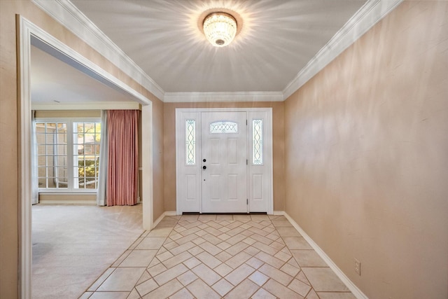 carpeted foyer entrance featuring ornamental molding