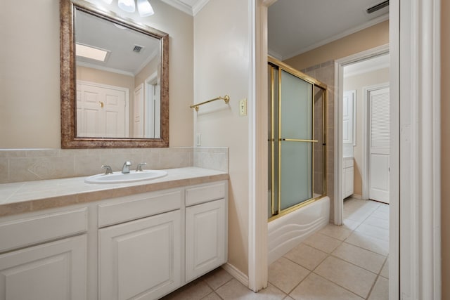 bathroom with combined bath / shower with glass door, tasteful backsplash, ornamental molding, vanity, and tile patterned floors