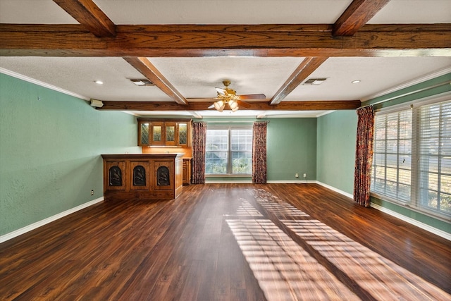 unfurnished living room with dark hardwood / wood-style floors, beamed ceiling, ornamental molding, ceiling fan, and a textured ceiling