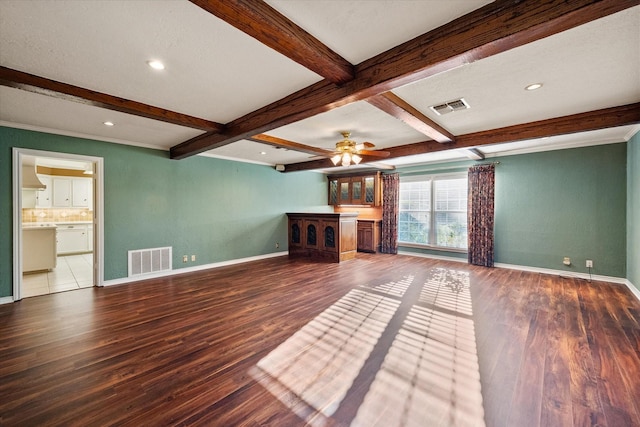 unfurnished living room with ceiling fan, wood-type flooring, and beam ceiling