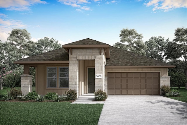 view of front of property with a garage and a front lawn