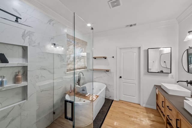 bathroom featuring crown molding, tile walls, vanity, independent shower and bath, and hardwood / wood-style floors