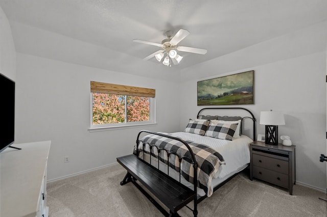 bedroom with ceiling fan and light colored carpet