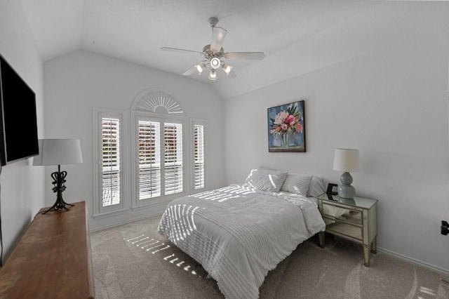 carpeted bedroom featuring vaulted ceiling and ceiling fan