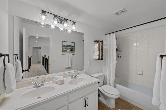 full bathroom with vanity, tile patterned floors, toilet, and shower / bath combo