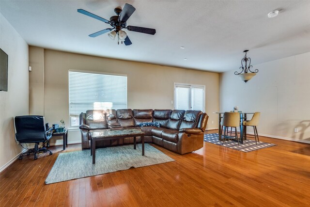 living room with hardwood / wood-style flooring and ceiling fan