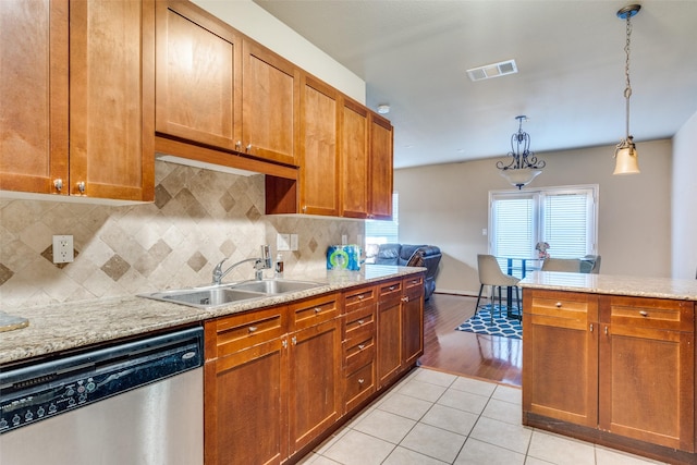 341 Metropolitan Dr, Plano, TX 75023 - kitchen featuring dishwasher, tasteful backsplash, light tile patterned flooring, and hanging light fixtures