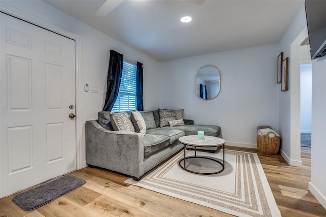 living room with light hardwood / wood-style flooring