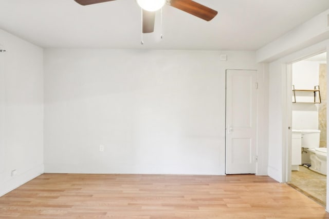 unfurnished room featuring a ceiling fan and light wood-style floors