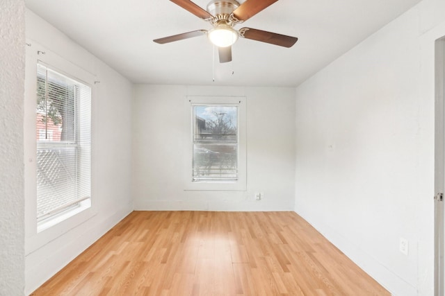 unfurnished room featuring ceiling fan and light wood-style floors