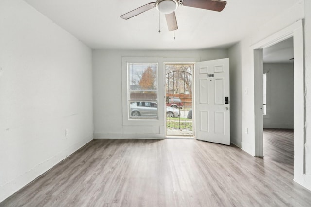 spare room featuring ceiling fan and light wood-type flooring