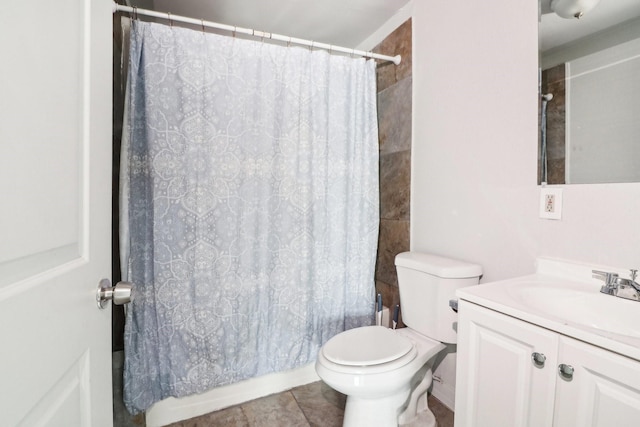 bathroom featuring toilet, shower / tub combo, vanity, and tile patterned floors