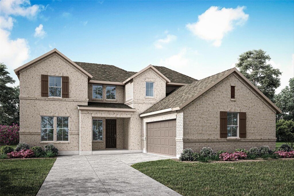 view of front of property with a garage and a front yard