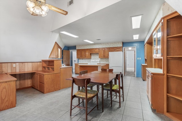 dining room featuring ceiling fan and light tile patterned floors