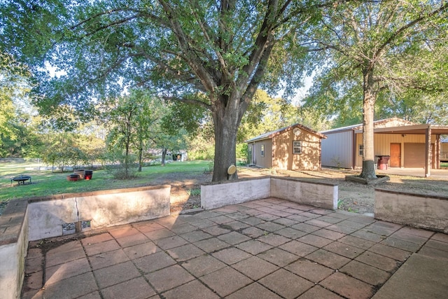 view of patio / terrace with a storage unit