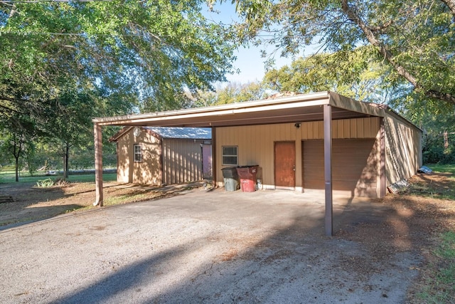 view of outbuilding with a carport