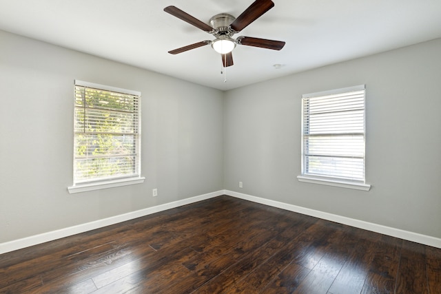 unfurnished room featuring ceiling fan and dark hardwood / wood-style floors