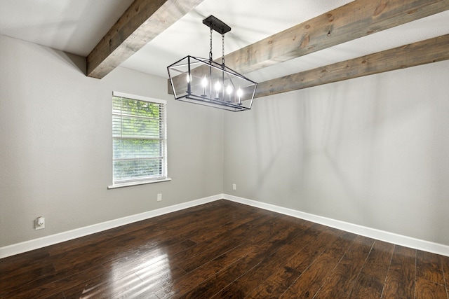 unfurnished dining area featuring an inviting chandelier, beam ceiling, and dark hardwood / wood-style floors