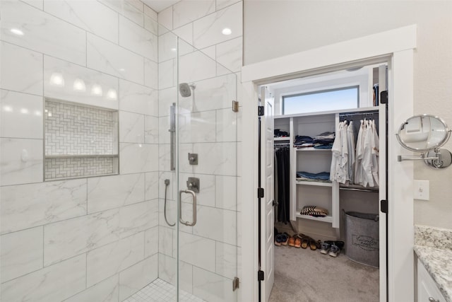 bathroom with vanity and walk in shower