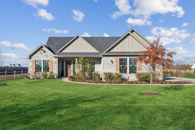 craftsman house with a front lawn