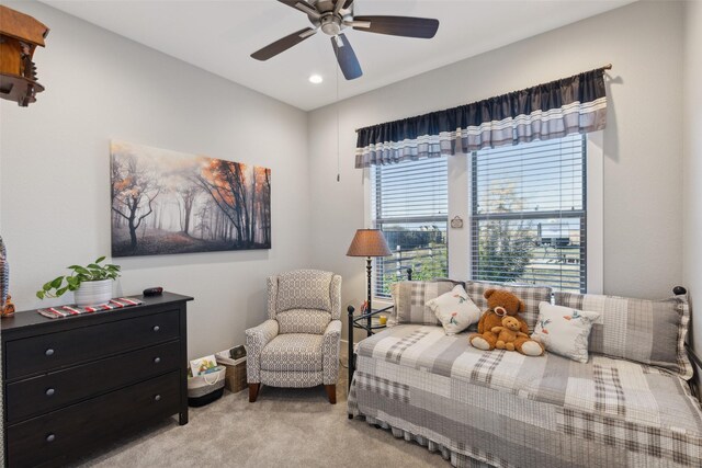 bedroom featuring ceiling fan and light colored carpet